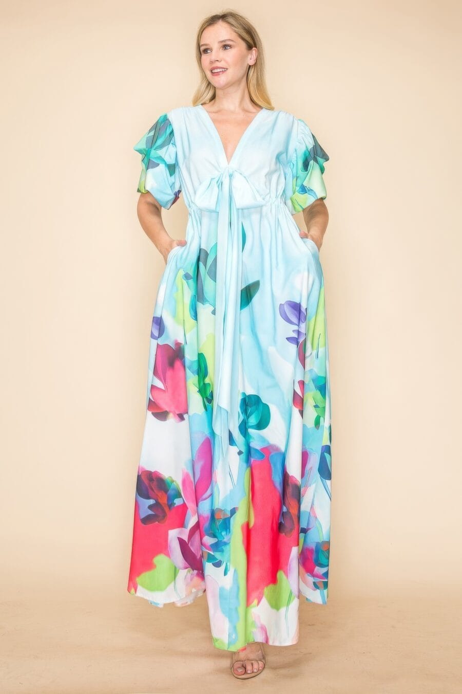 Printed v neck maxi dress with self-tie waist, v-neckline, and practical pockets.