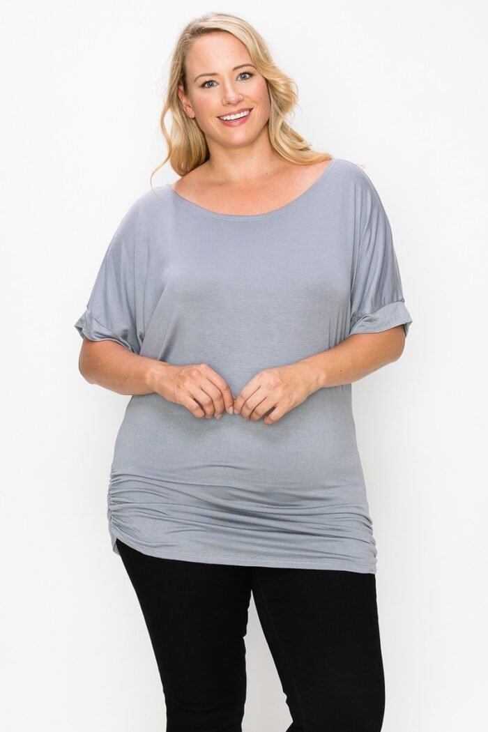 Short sleeve top featuring a round neck and ruched sides