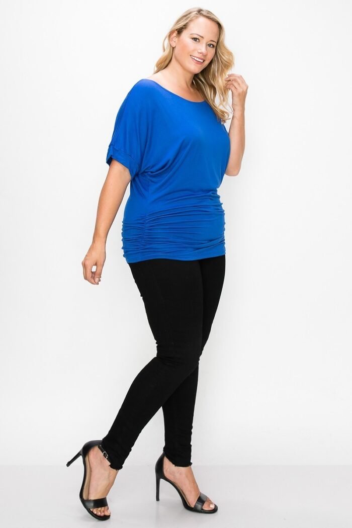 Short sleeve top featuring a round neck and ruched sides