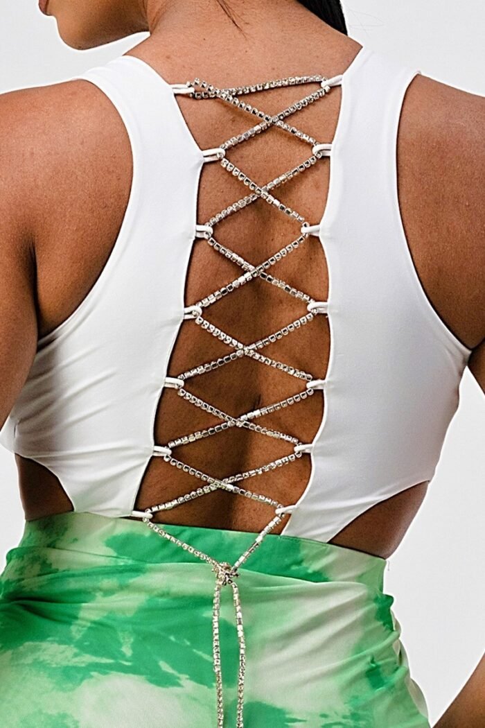 White sleeveless top with detachable rhinestone cross open back with bodycon...