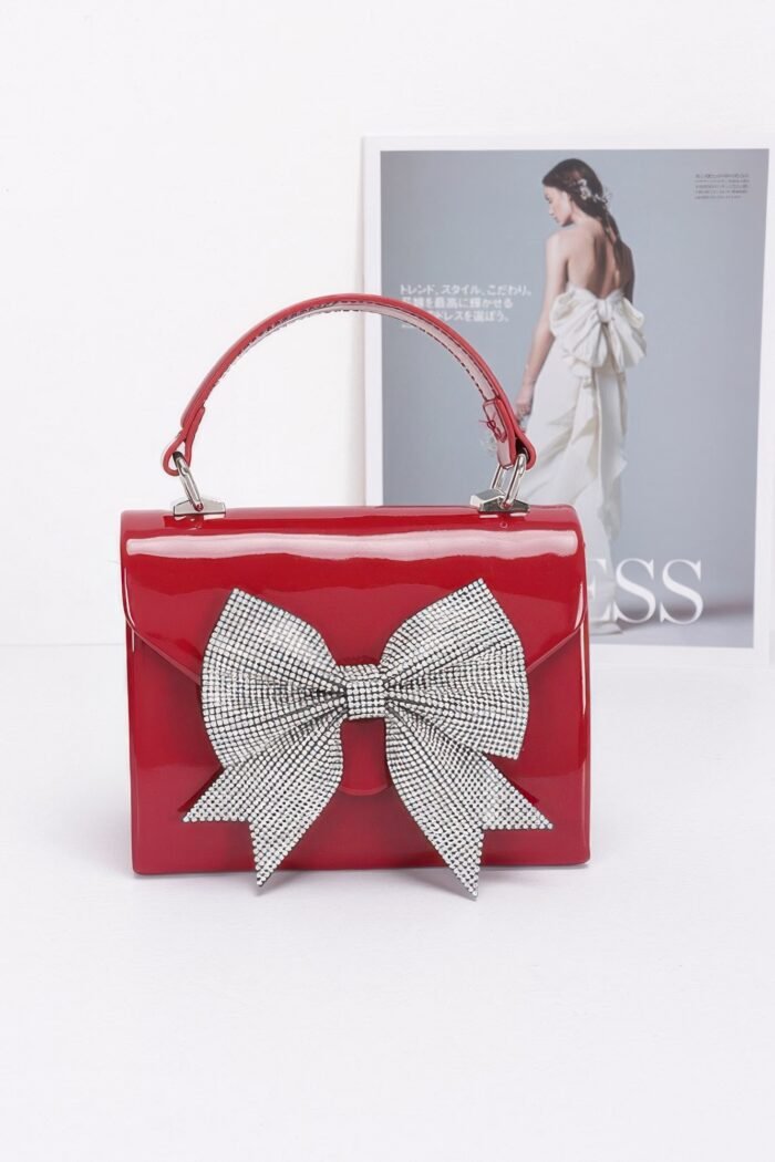 Enamel rhinestone ribbon top handle clutch