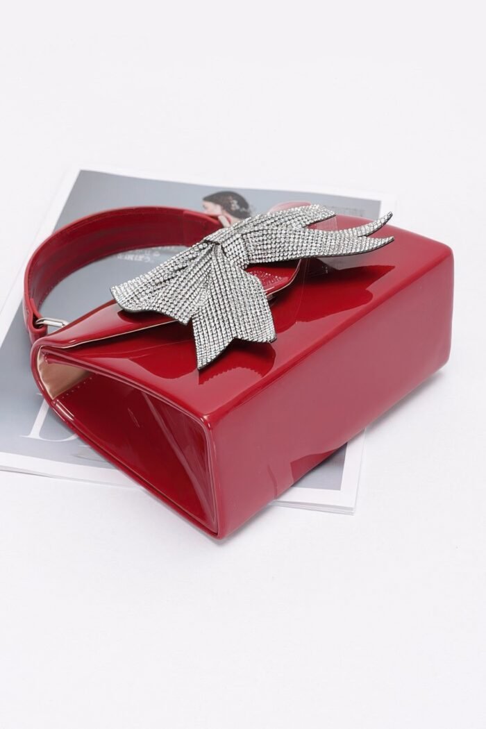 Enamel rhinestone ribbon top handle clutch