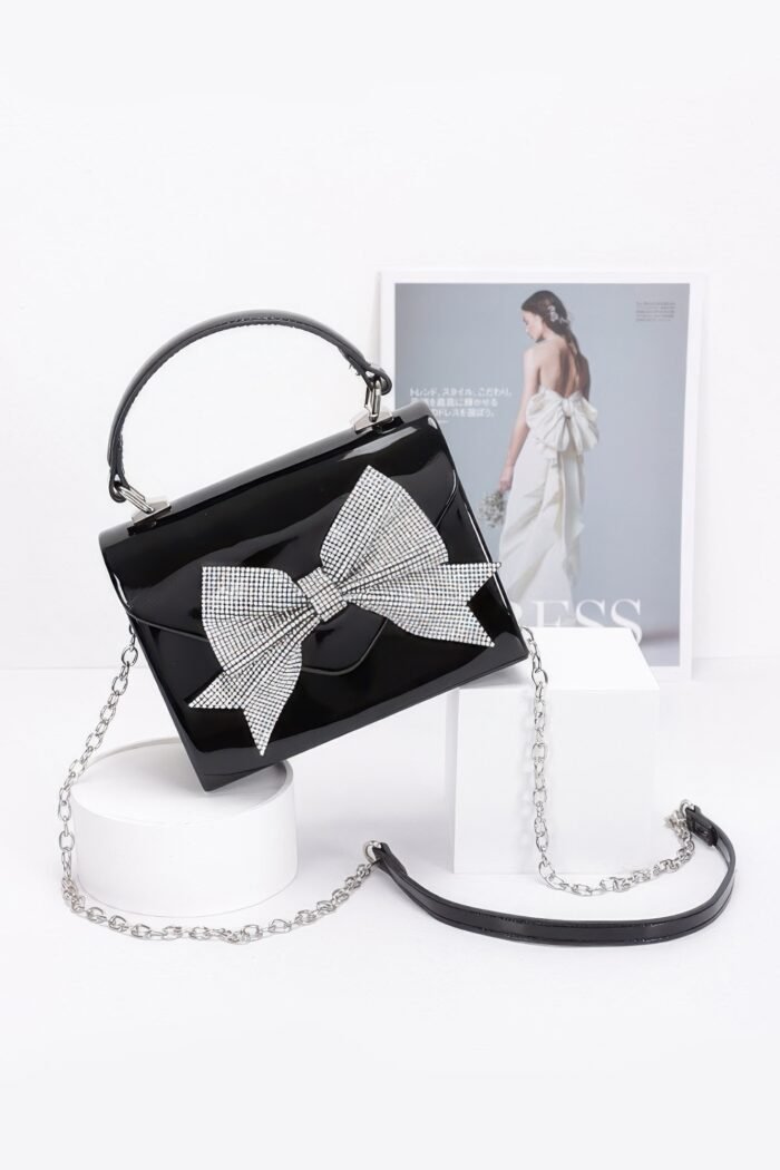 Enamel rhinestone ribbon top handle clutch