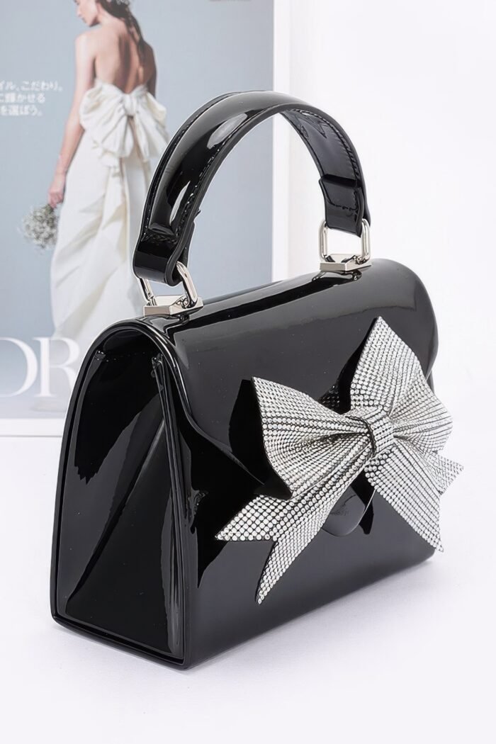 Enamel rhinestone ribbon top handle clutch