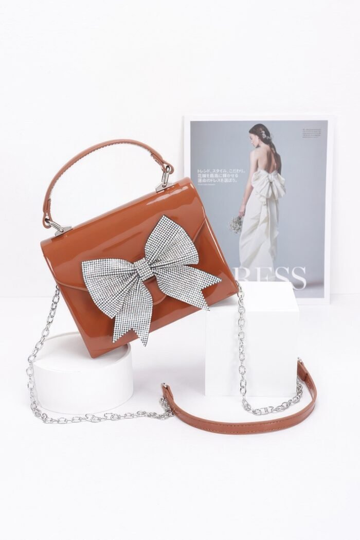 Enamel rhinestone ribbon top handle clutch