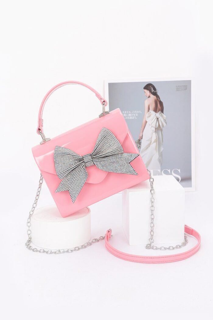 Enamel rhinestone ribbon top handle clutch