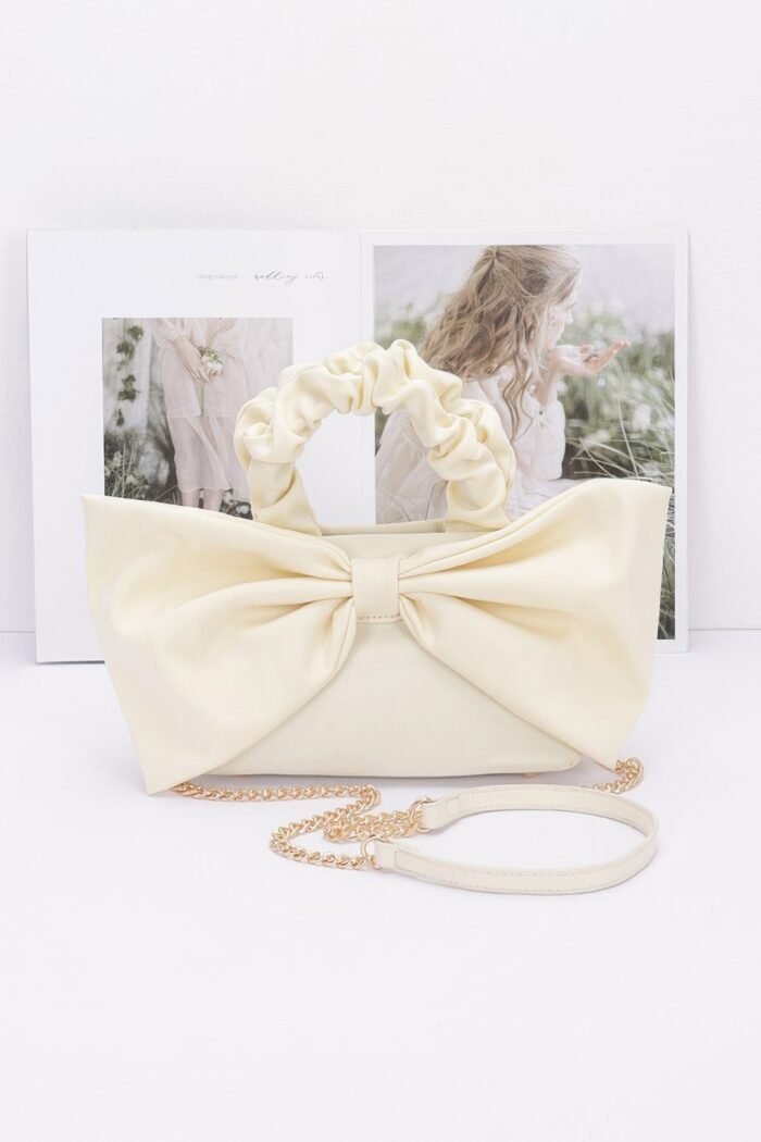 Nylon top handle bag with bow front clutch