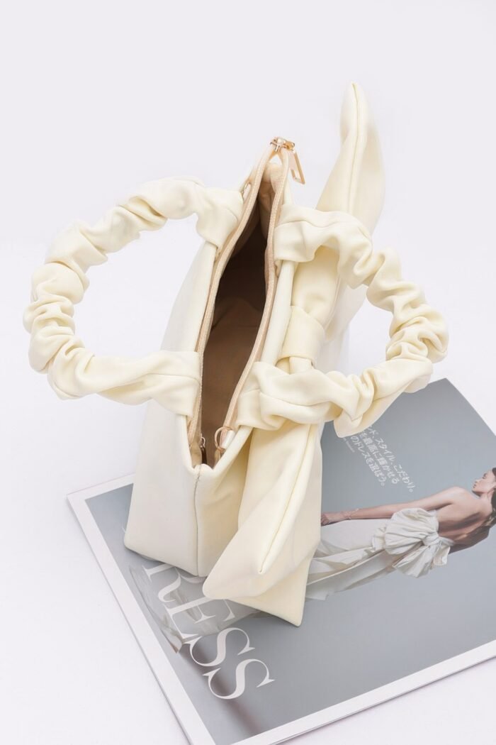 Nylon top handle bag with bow front clutch