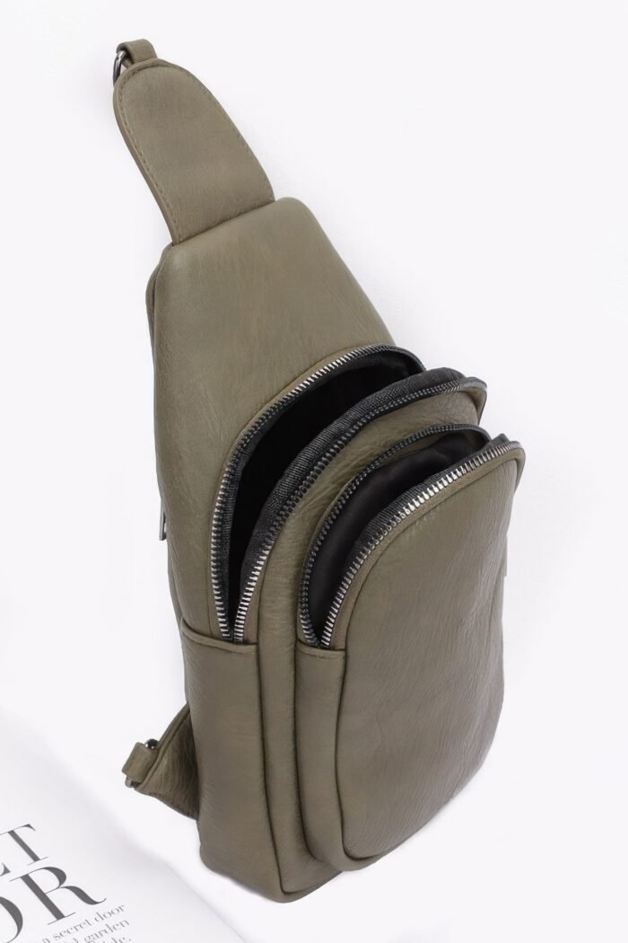 Faux leather sling bag w/multi color strap