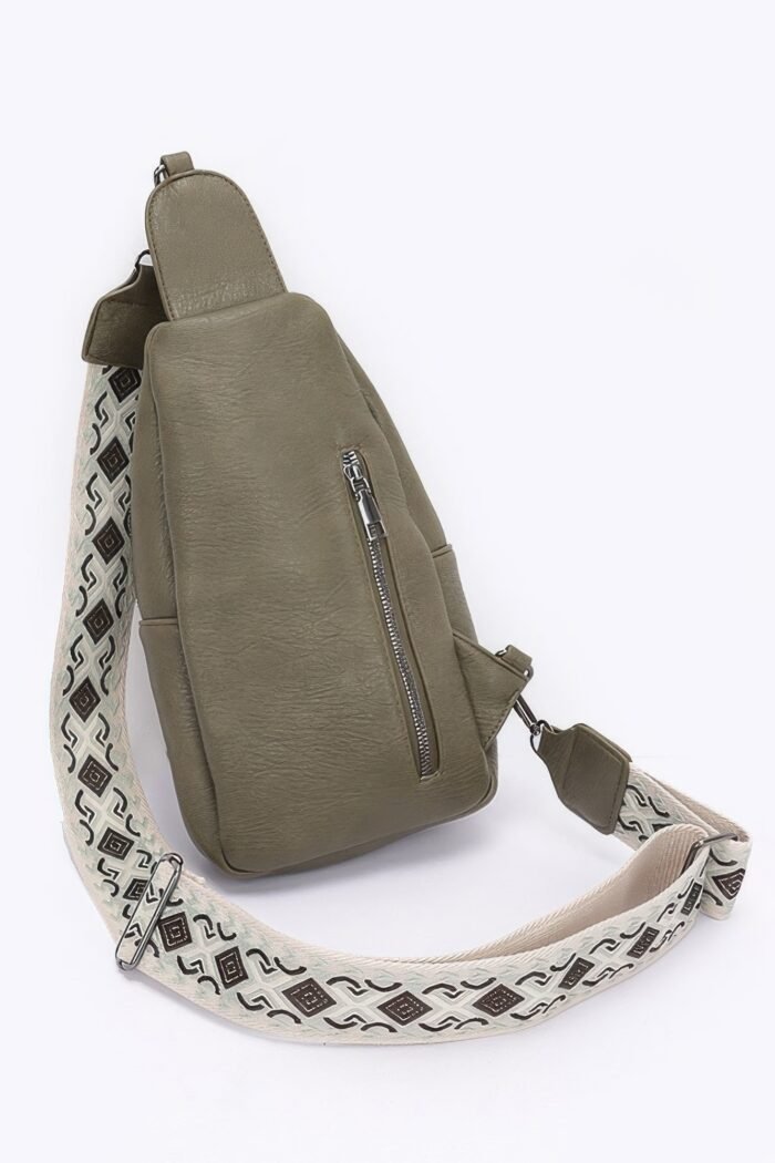 Faux leather sling bag w/multi color strap
