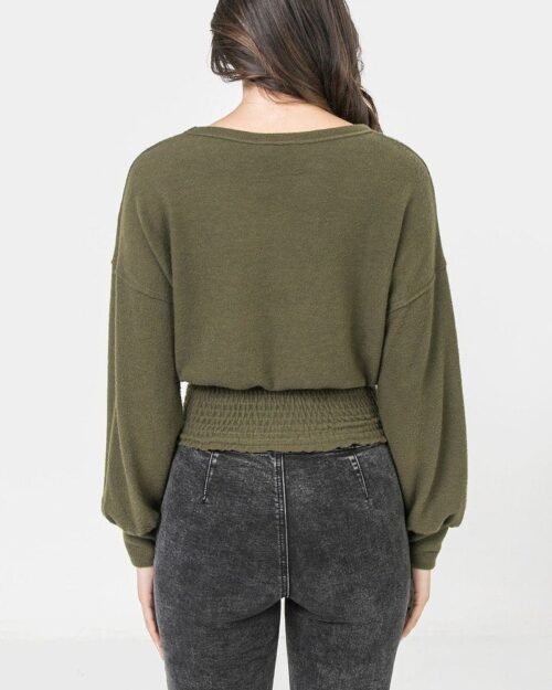a knit top featuring wide neckline