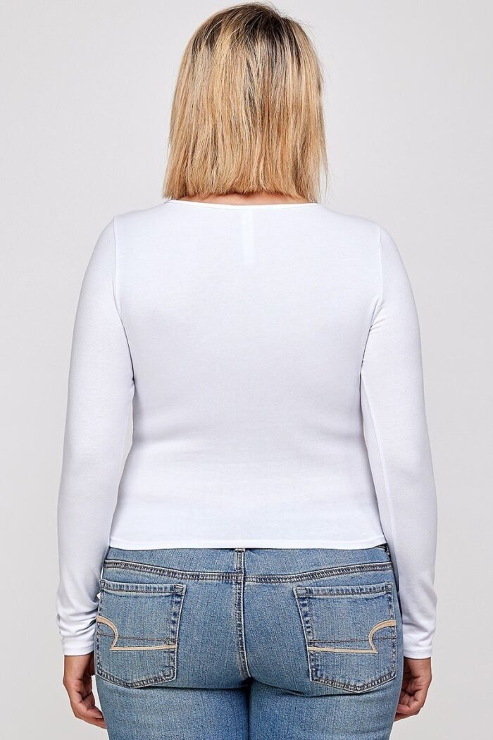 Solid round neck top, with long sleeves, and cut-out detail