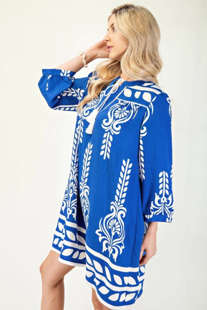 Printed 3/4 sleeve dress with tassel tie and fringe detail on hem