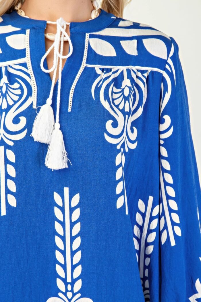 Printed 3/4 sleeve dress with tassel tie and fringe detail on hem