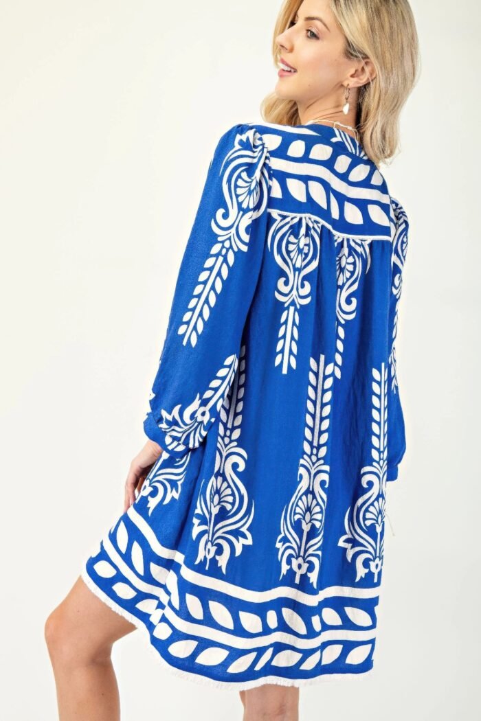Printed 3/4 sleeve dress with tassel tie and fringe detail on hem