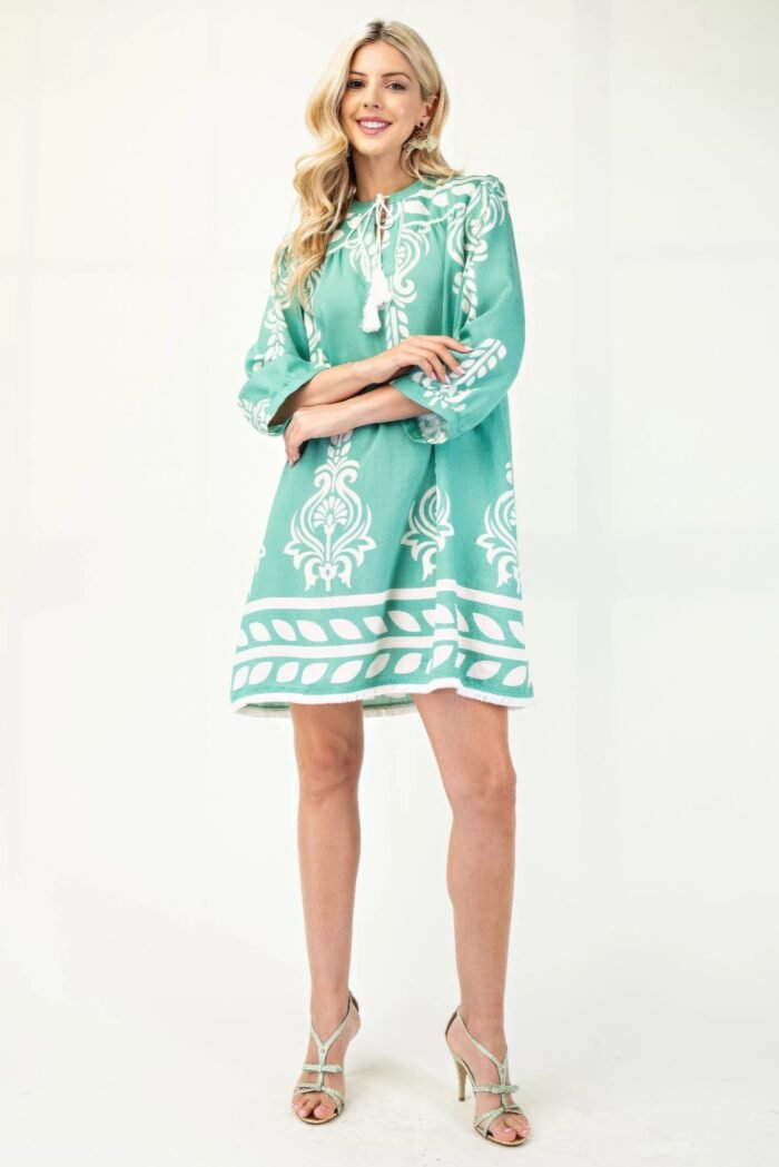 Printed 3/4 sleeve dress with tassel tie and fringe detail on hem