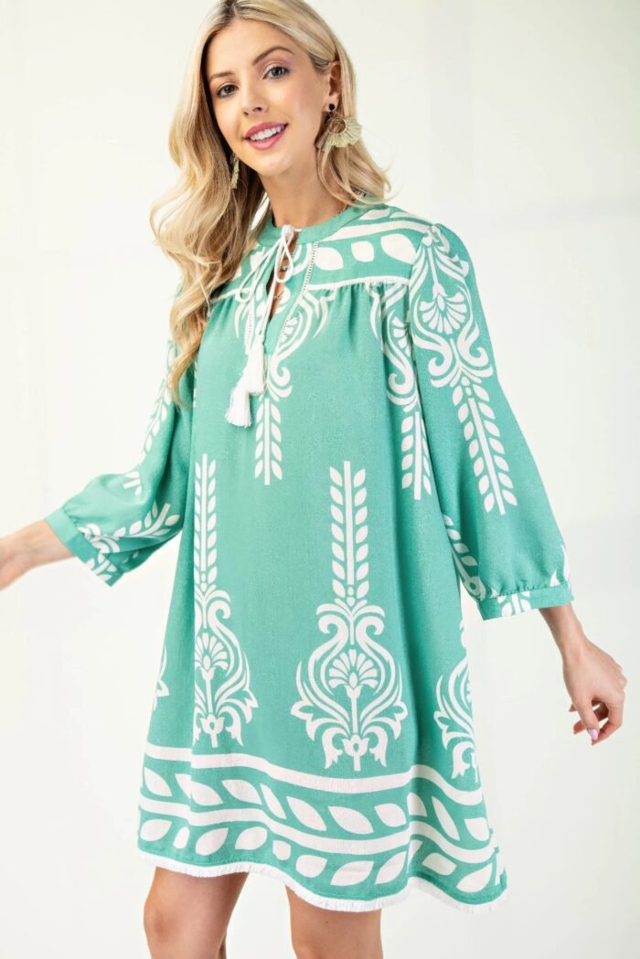 Printed 3/4 sleeve dress with tassel tie and fringe detail on hem