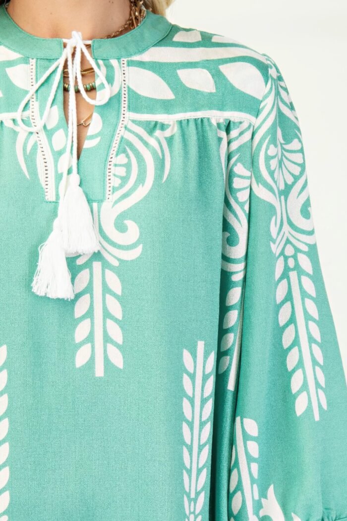Printed 3/4 sleeve dress with tassel tie and fringe detail on hem