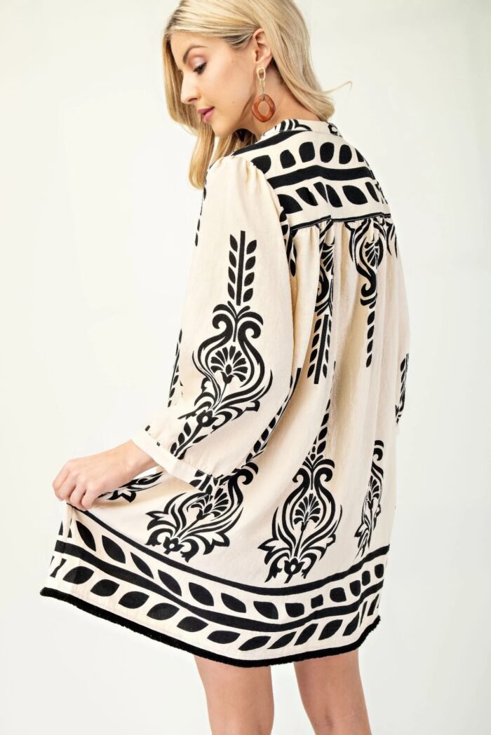 Printed 3/4 sleeve dress with tassel tie and fringe detail on hem
