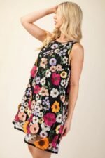 3D floral embroidered mini dress in white with sleeveless design and romantic detailing