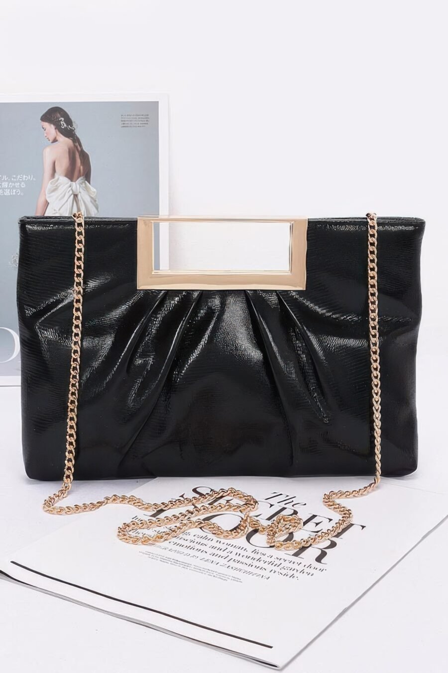 Faux leather metal handle clutch