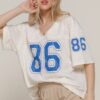 Oversized mesh baseball t-shirt with silk screen print, short sleeves, and breathable fabric – streetwear-inspired sporty unisex top.