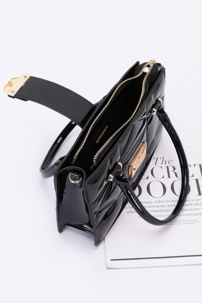 Embossed enamel handle clutch