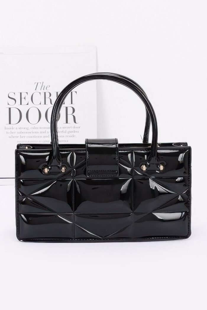 Embossed enamel handle clutch