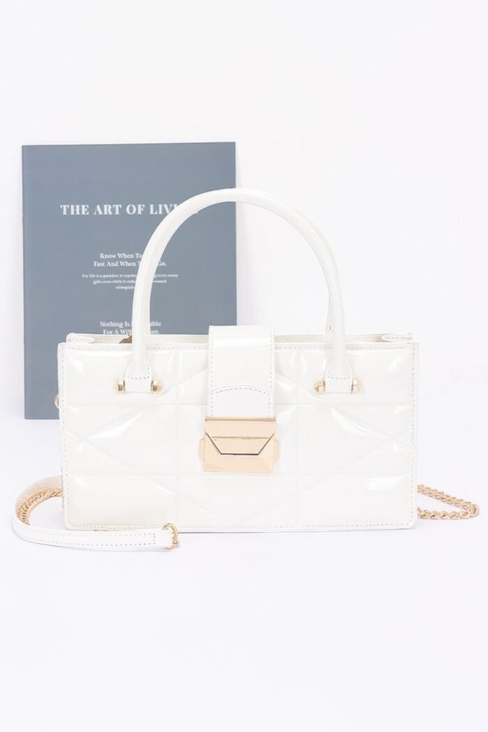 Embossed enamel handle clutch
