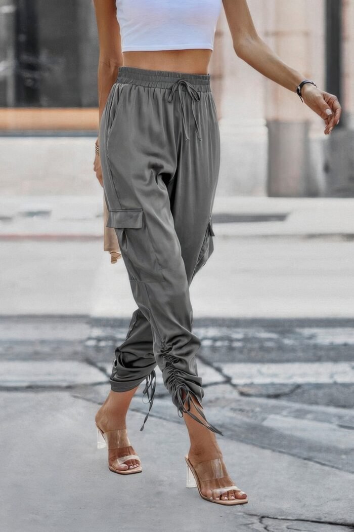 Solid drawstring hem flap pocket side stacked pant