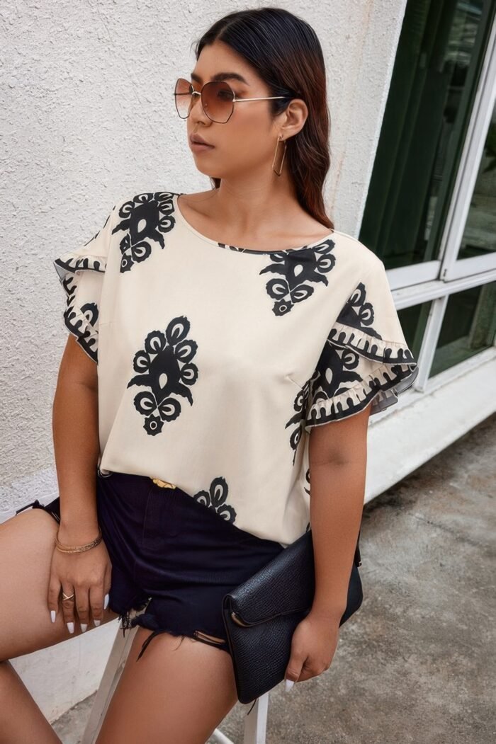 Plus printed ruffle hem wide round neck blouse