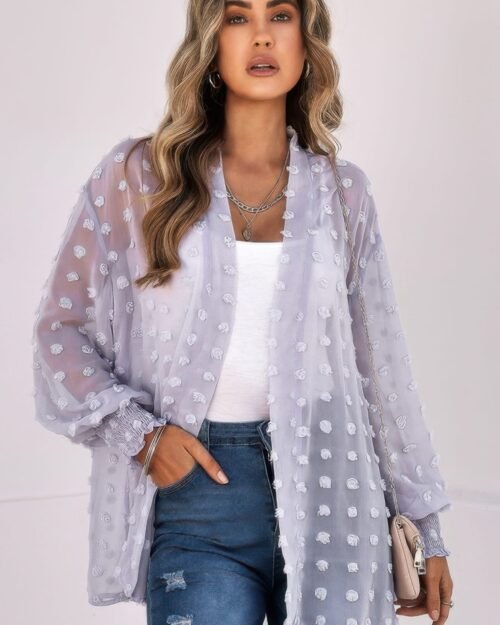 woman wearing polka dot open front top – long sleeve, lightweight casual blouse with front tie or button design