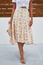 Woman wearing floral high waist long skirt – A-line printed maxi skirt for casual and modest wear