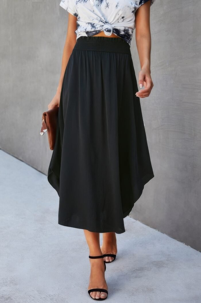 Solid shirred waist asymmetrical hem flared skirt - image 1