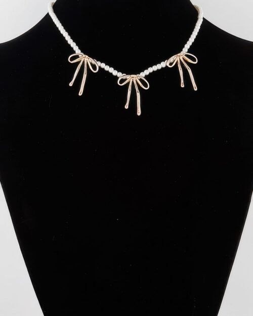 Pearl And Metal Ribbon Charm Necklace