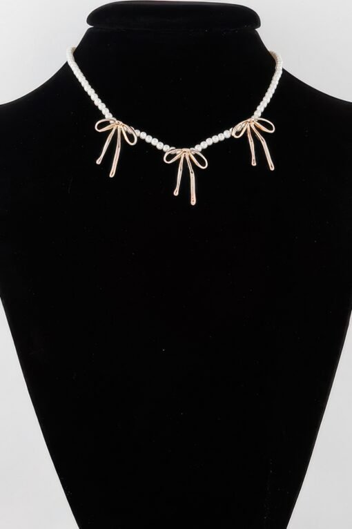 Pearl And Metal Ribbon Charm Necklace